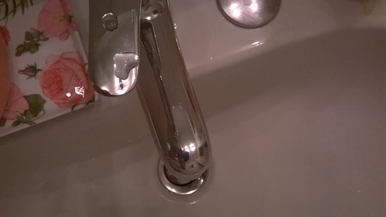 a heart made of water on the faucet
